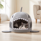 Grey shark cat bed with a cat lying in the shark's mouth